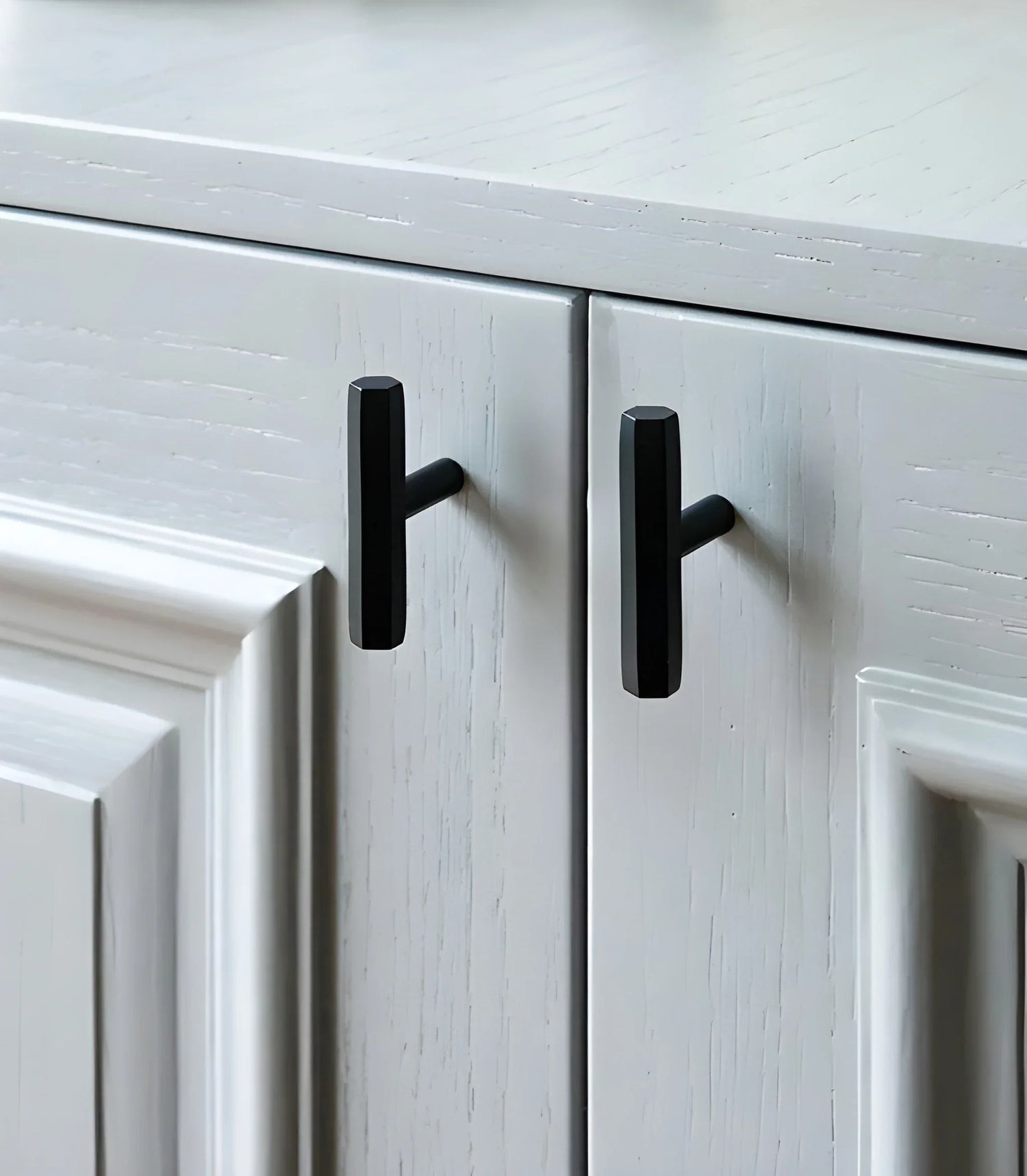 The Mantara B-0052 Oblivion T-Bar Handle is a modern solid brass handle in matte black, gold, and bronze, ideal for cabinets, kitchens, bedrooms, and drawers.