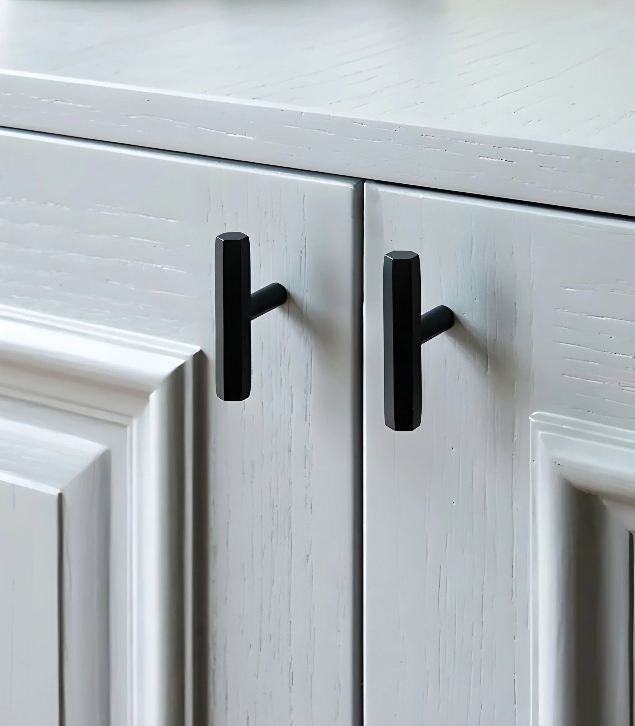 The Mantara B-0052 Oblivion T-Bar Handle is a modern solid brass handle in matte black, gold, and bronze, ideal for cabinets, kitchens, bedrooms, and drawers.