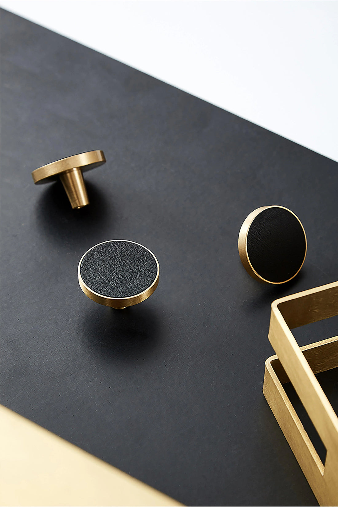 The Mantara L-0004 Obsidian Knob is a modern brass and leather knob in black, perfect for wardrobes, kitchens, and cabinets.
