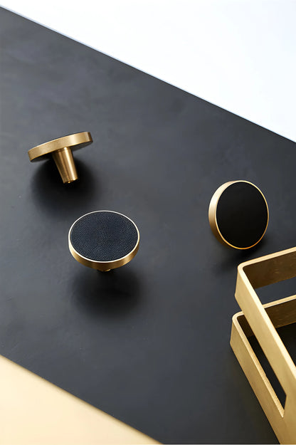 The Mantara L-0004 Obsidian Knob is a modern brass and leather knob in black, perfect for wardrobes, kitchens, and cabinets.