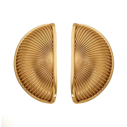 The Odette Handle by Mantara B-0107 is a polished brass handle in gold, perfect for drawers, cupboards, and kitchens.