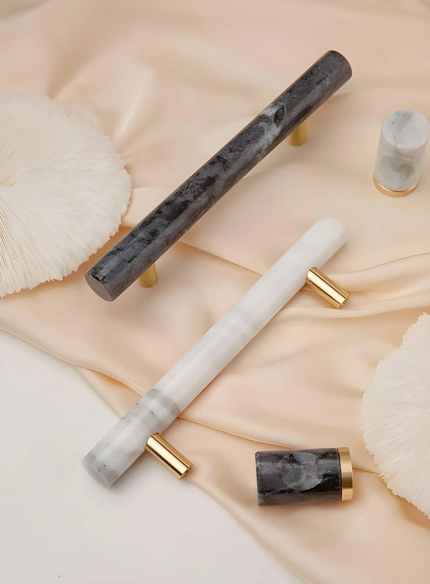 The Mantara M-0008-128 Onyx Handle is a modern marble and brass handle in black, ideal for wardrobes and cabinets.