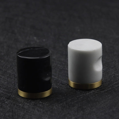 The Mantara M-0008 Onyx Knob is a modern marble and brass knob in white, ideal for doors, cabinets, and furniture.