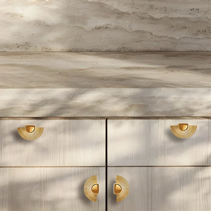 Mantara Palm Knob B-0085 is a modern polished brass knob in gold, perfect for doors, cabinets, and wardrobes.
