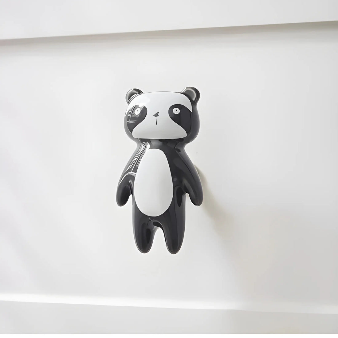 The Mantara CR-0001-Panda Knob is a modern black ceramic knob with a polished finish, perfect for wardrobes, drawers, cabinets, and kids&