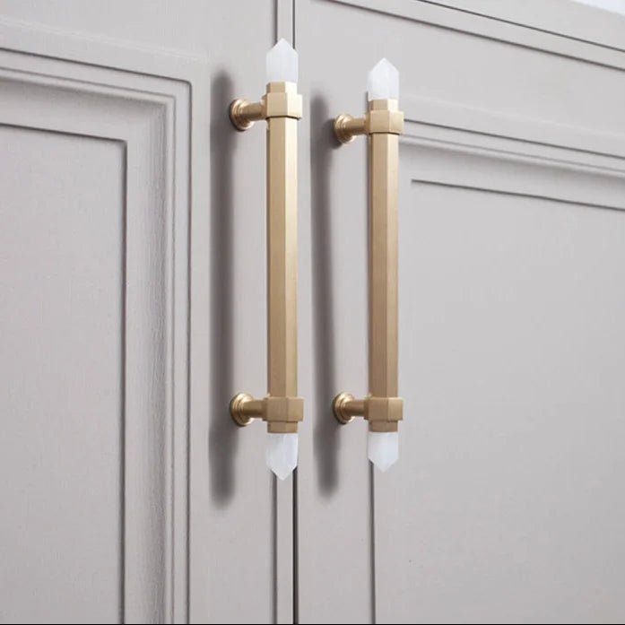 The Mantara C-0015 Quartz Handle is a modern brass and crystal handle in white, ideal for doors, wardrobes, and cabinets.