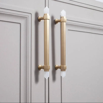 The Mantara C-0015 Quartz Handle is a modern brass and crystal handle in white, ideal for doors, wardrobes, and cabinets.