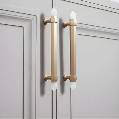 The Mantara C-0015 Quartz Handle is a modern brass and crystal handle in white, ideal for doors, wardrobes, and cabinets.