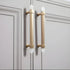 The Mantara C-0015 Quartz Handle is a modern brass and crystal handle in white, ideal for doors, wardrobes, and cabinets.