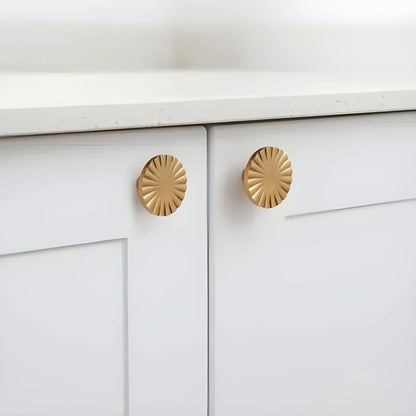 The Mantara B-0028 Rasya Knob is a modern gold brass knob with brushed finish, ideal for doors, drawers, cabinets, and wardrobes