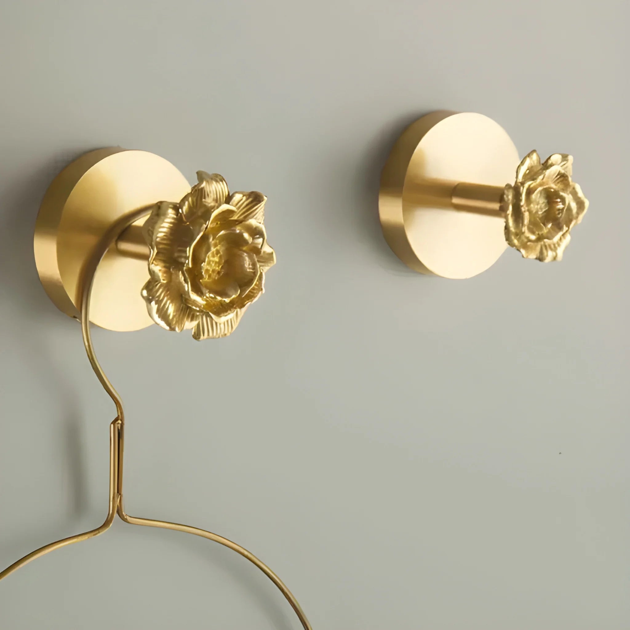 The Rosalia Hook by Mantara B-0117 is a modern brass wall hook in gold with a brushed finish, perfect for kitchens and dressers.