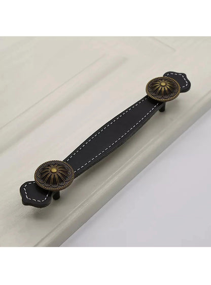 The Mantara L-0006 Royal Leather Handle is a modern black leather handle, ideal for furniture, cabinets, and wardrobes.