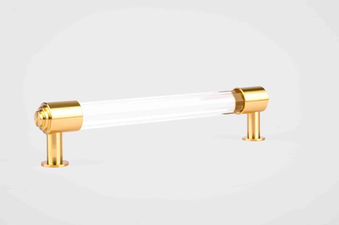 The Mantara C-0023 Sapience Handle is a modern crystal and brass handle in white transparent, perfect for cabinets, drawers, and wardrobes.