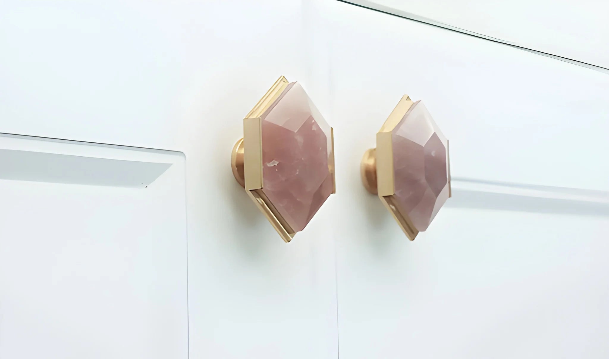The Mantara C-0004 is a Nordic crystal + brass knob in pink, ideal for wardrobes, drawers &amp; cabinets.