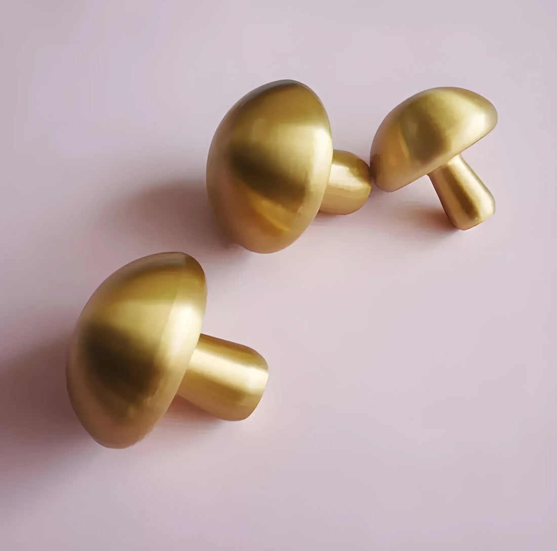 Mantara Shroom Knob B-0100 is a modern solid brass knob in brushed gold, perfect for kitchens, cabinets, and furniture.
