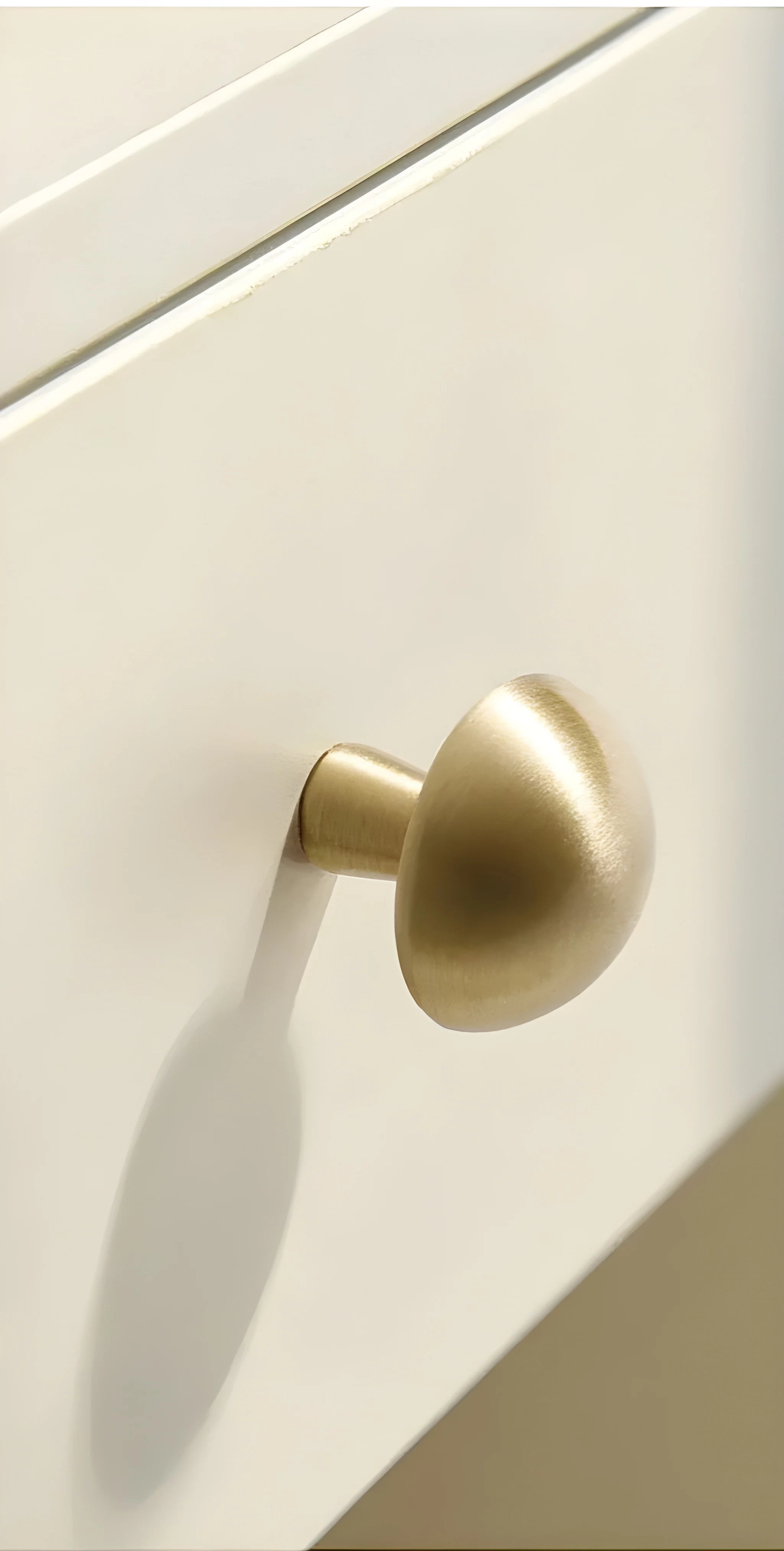 Mantara Shroom Knob B-0100 is a modern solid brass knob in brushed gold, perfect for kitchens, cabinets, and furniture.