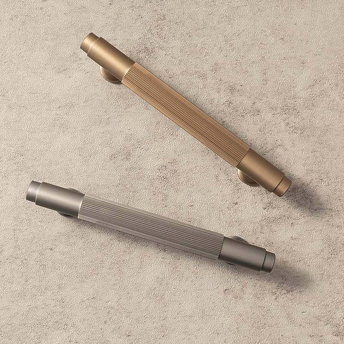 A versatile bar handle in aluminum alloy with matte rose gold or grey finish, Mantara AL-0002 bar handle for cabinets and wardrobes.