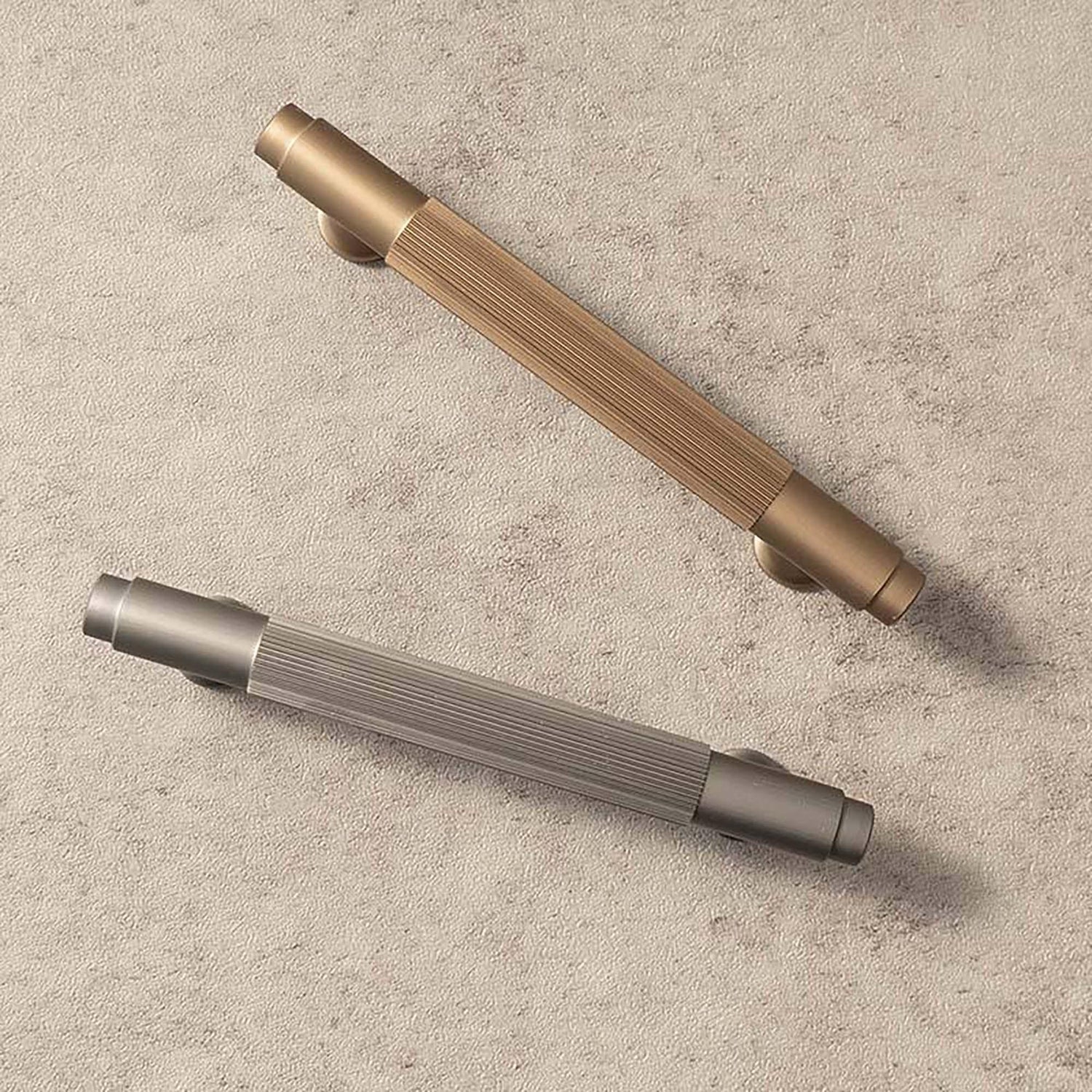 A versatile bar handle in aluminum alloy with matte rose gold or grey finish, Mantara AL-0002 bar handle for cabinets and wardrobes.