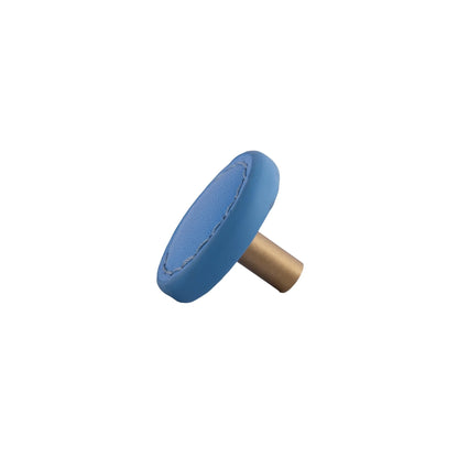 The Mantara L-0008 Sofia Round Knob is a modern leather knob in blue, ideal for cabinets and wardrobes.