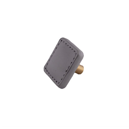 The Mantara L-0008 Sofia Square Knob is a modern leather knob in grey, perfect for cabinets and drawers.