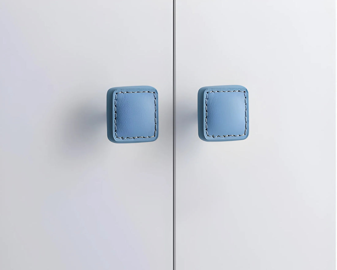 The Mantara L-0008 Sofia Square Knob is a modern leather knob in blue, perfect for cabinets and drawers.
