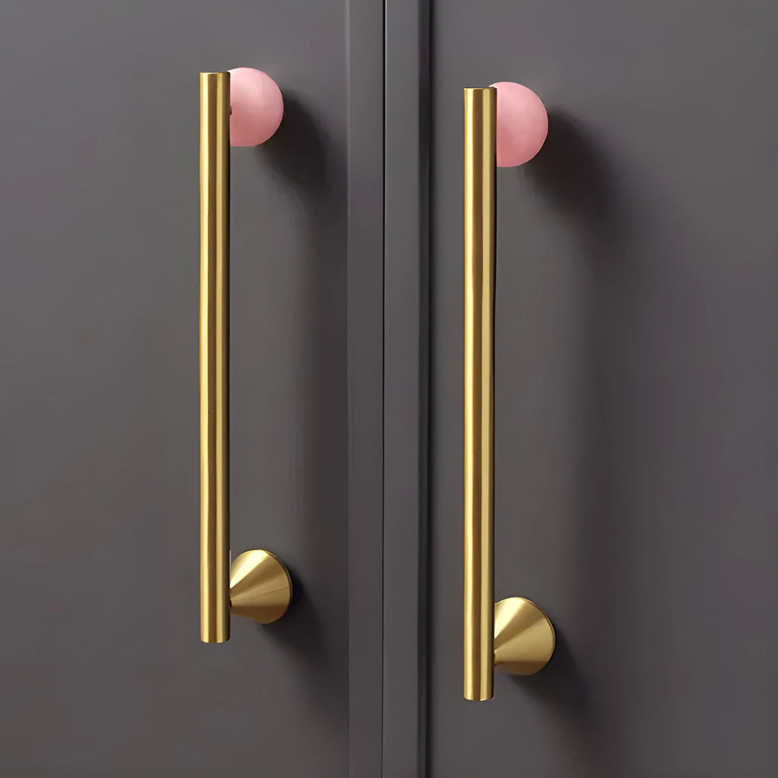 The Mantara C-0022 Solstice Handle is a modern crystal and brass handle in pink, ideal for wardrobes, drawers, and cabinets.