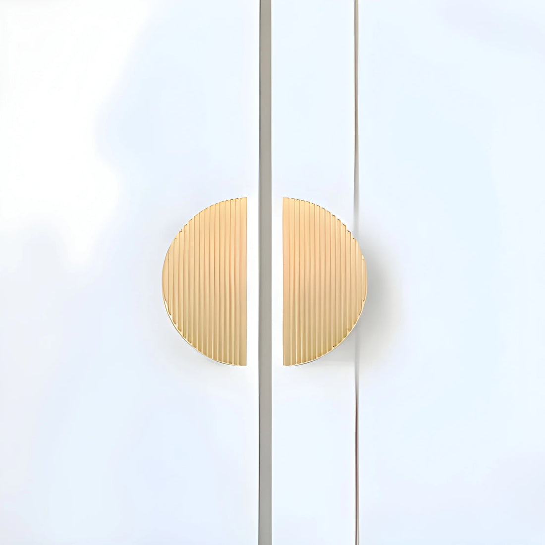 The Sorelle Handle by Mantara B-0113 is a modern brushed brass knob in gold, perfect for kitchen drawers and cabinets.