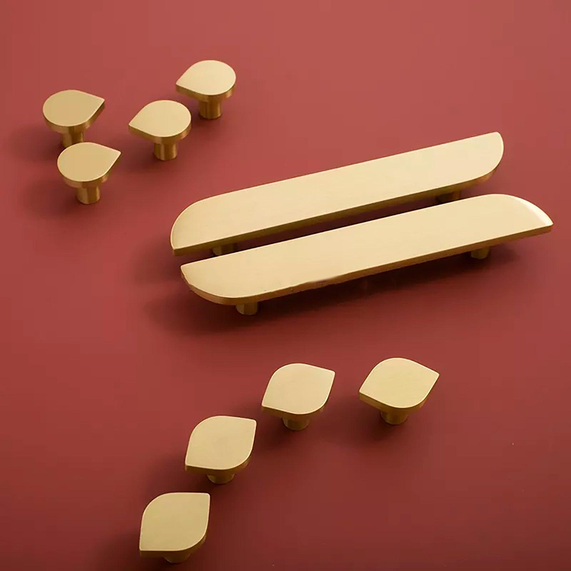 The Tarang handle by Mantara (B-0104) is a brushed brass modern pair knob in gold, perfect for wardrobes, doors, and kitchens.