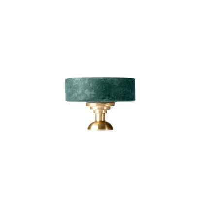The Mantara M-0001 Theo Knob is a modern marble and brass knob in green, ideal for doors, drawers, and cabinets.