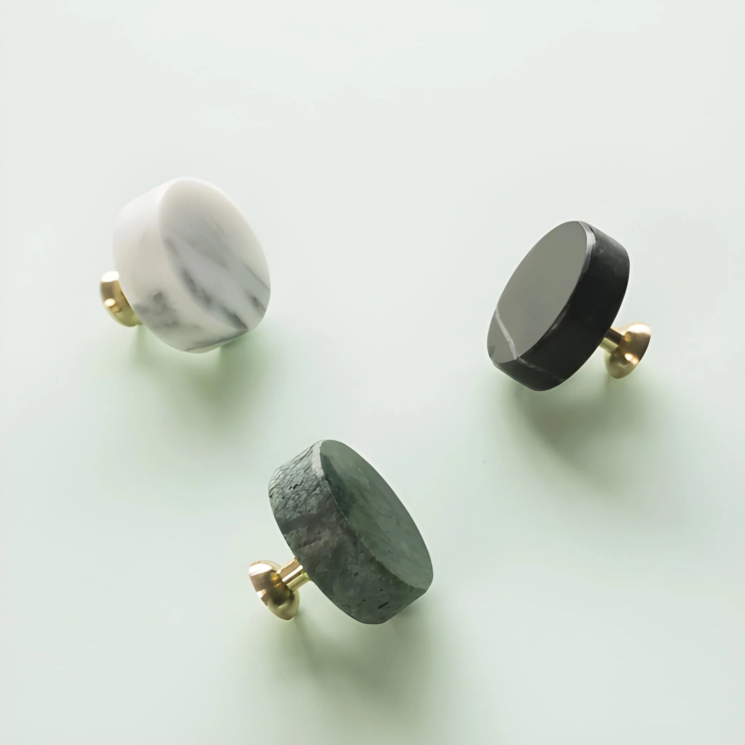 The Mantara M-0001 Theo Knob is a modern marble and brass knob in Grey, ideal for doors, drawers, and cabinets.