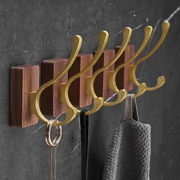 Mantara Thorne Hook W-0032 is a modern space aluminum and walnut hook in gold and  ideal for kitchen and dresser drawers.