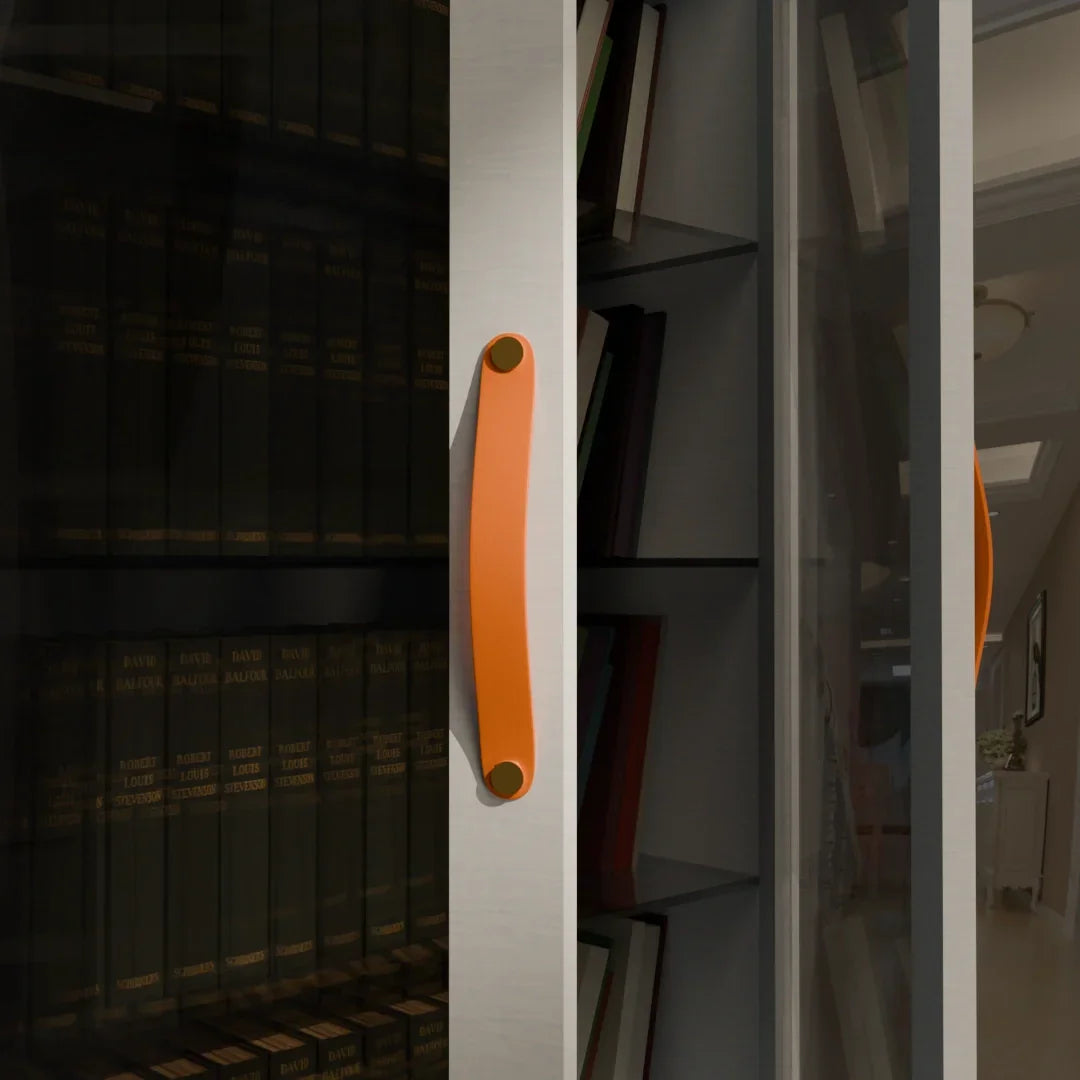 The Mantara L-0001-160 Maverick Handle is a Nordic leather and brass handle in orange, ideal for kitchens and wardrobes.