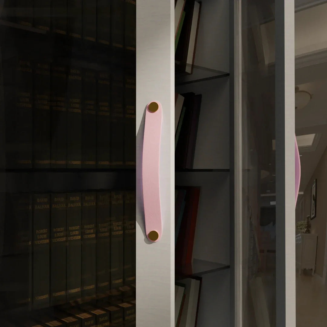 The Mantara L-0001-160 Maverick Handle is a Nordic leather and brass handle in pink, ideal for kitchens and wardrobes.