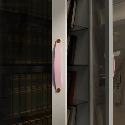 The Mantara L-0001-160 Maverick Handle is a Nordic leather and brass handle in pink, ideal for kitchens and wardrobes.