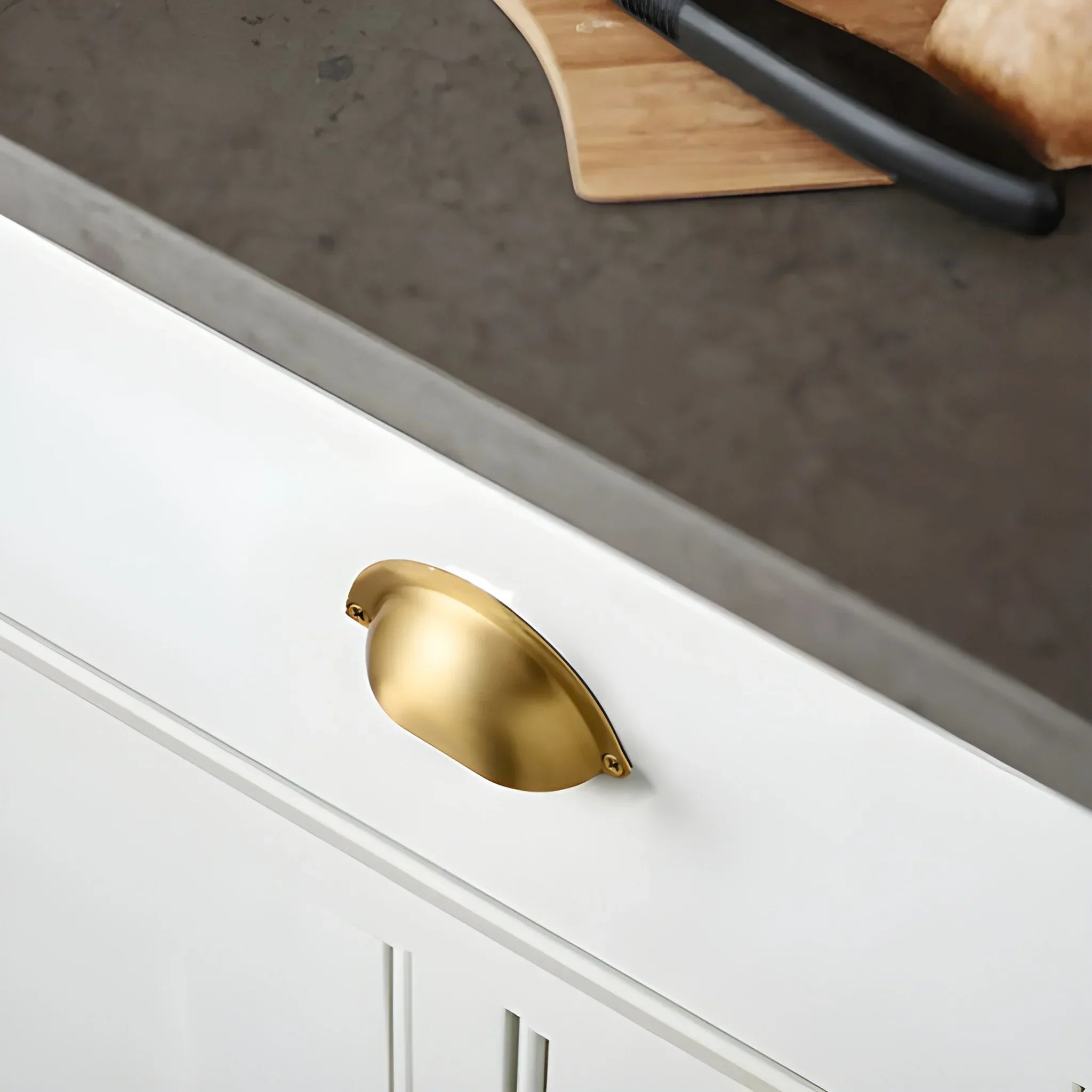 The Mantara B-0034 Vajra Knob is a modern brushed brass knob in gold, ideal for kitchens, drawers, cabinets, and bedrooms.