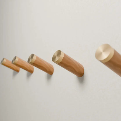 Mantara Flair Hook W-0013 is a natural wood &amp; brass wall hook in beige with polished finish, ideal for homes &amp; hotels.