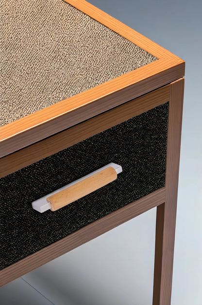 Wooden side table with a textured top and black drawer featuring a wooden handle—contrasting materials by Mantara.