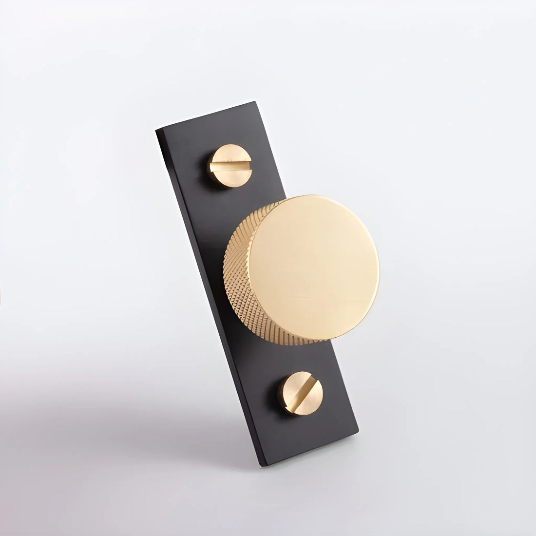 The Mantara B-0118 is a modern brass knob in gold with a black stabiliser base, ideal for kitchen and dresser drawers.