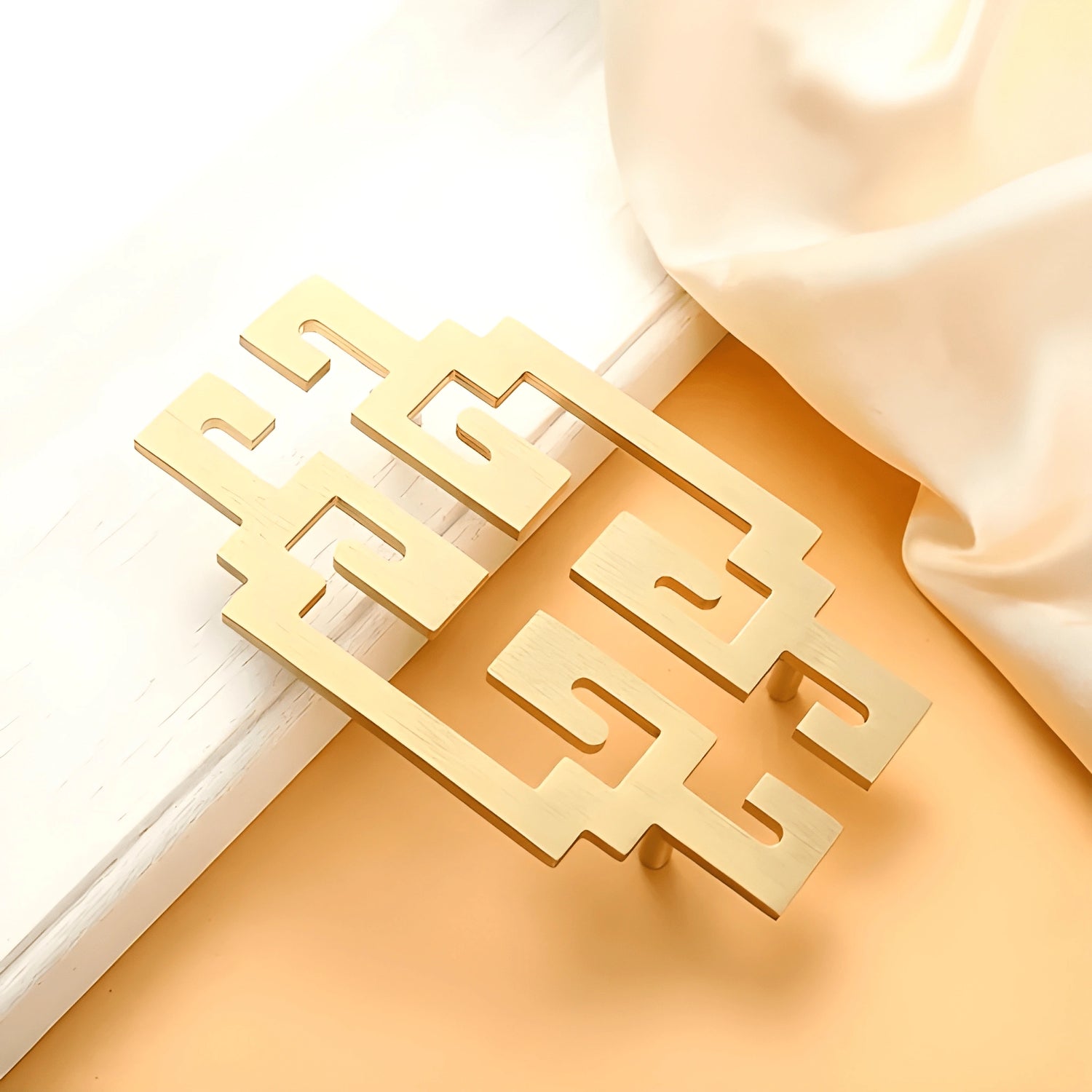 Mantara Yin Handle SKU B-0082 is a modern brass handle in brushed gold, ideal for drawers, furniture, and bedrooms.