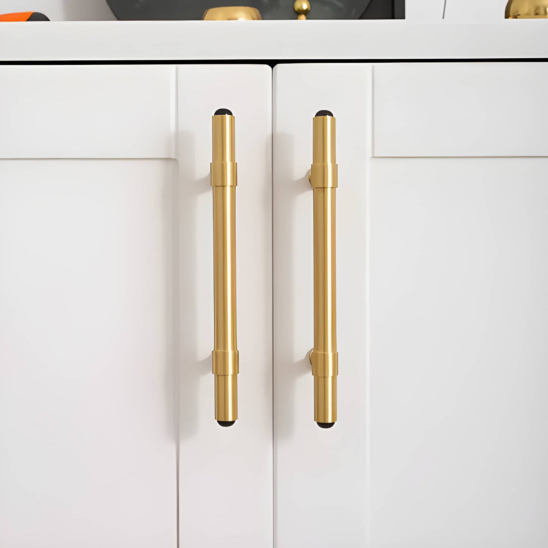 The Zania Handle by Mantara B-0111 is a modern brushed brass handle in gold, ideal for kitchens, dressers, and cabinets.