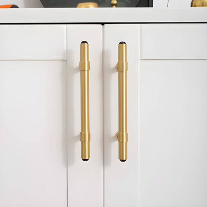 The Zania Handle by Mantara B-0111 is a modern brushed brass handle in gold, ideal for kitchens, dressers, and cabinets.