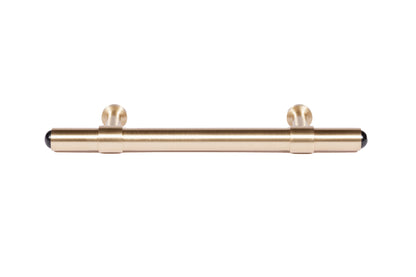 The Zania Handle by Mantara B-0111 is a modern brushed brass handle in gold, ideal for kitchens, dressers, and cabinets.