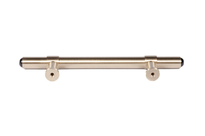 The Zania Handle by Mantara B-0111 is a modern brushed brass handle in gold, ideal for kitchens, dressers, and cabinets.