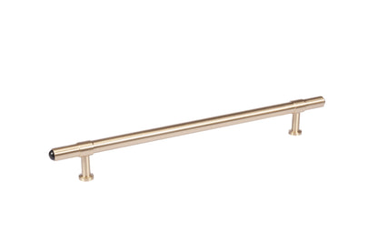 The Zania Handle by Mantara B-0111 is a modern brushed brass handle in gold, ideal for kitchens, dressers, and cabinets.