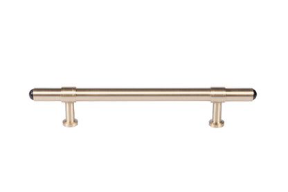 The Zania Handle by Mantara B-0111 is a modern brushed brass handle in gold, ideal for kitchens, dressers, and cabinets.