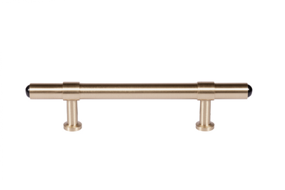 The Zania Handle by Mantara B-0111 is a modern brushed brass handle in gold, ideal for kitchens, dressers, and cabinets.