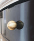 The Mantara B-0001 Zenith Knob is a modern brass knob in gold, black, and bronze with a brushed finish, ideal for cabinets and furniture.