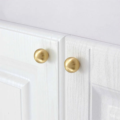 The Mantara B-0001 Zenith Knob is a modern brass knob in gold, black, and bronze with a brushed finish, ideal for cabinets and furniture.