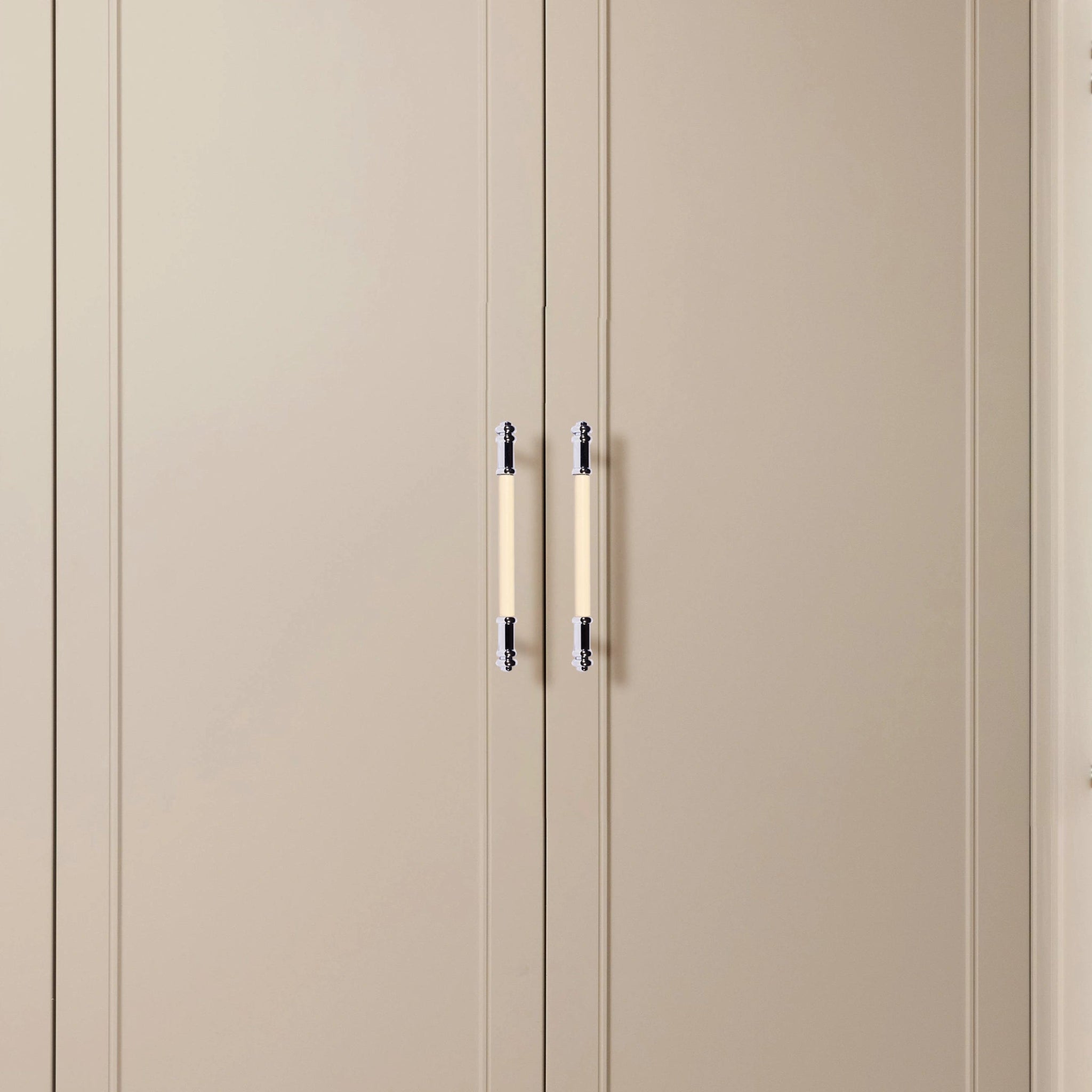 Beige wardrobe with two doors and sleek metallic handles, offering a soft, contemporary look by Mantara.
