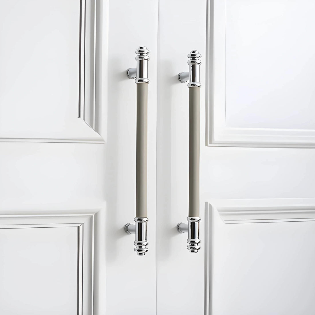 The Mantara L-0013 is a modern brass + leather handle in grey, ideal for kitchen drawers, dressers, and cabinets.